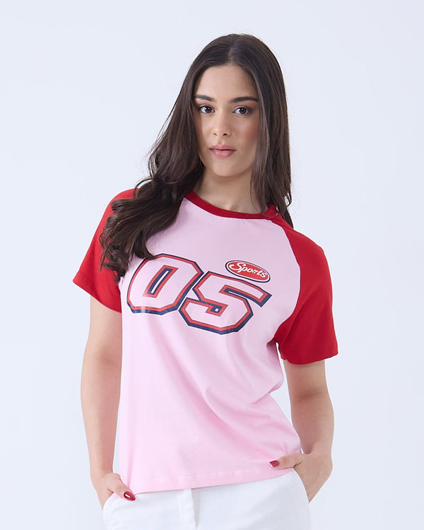 05 Sports Raglan T-Shirt by DKY - pink body with red sleeves and bold 05 graphic on front, worn by model
