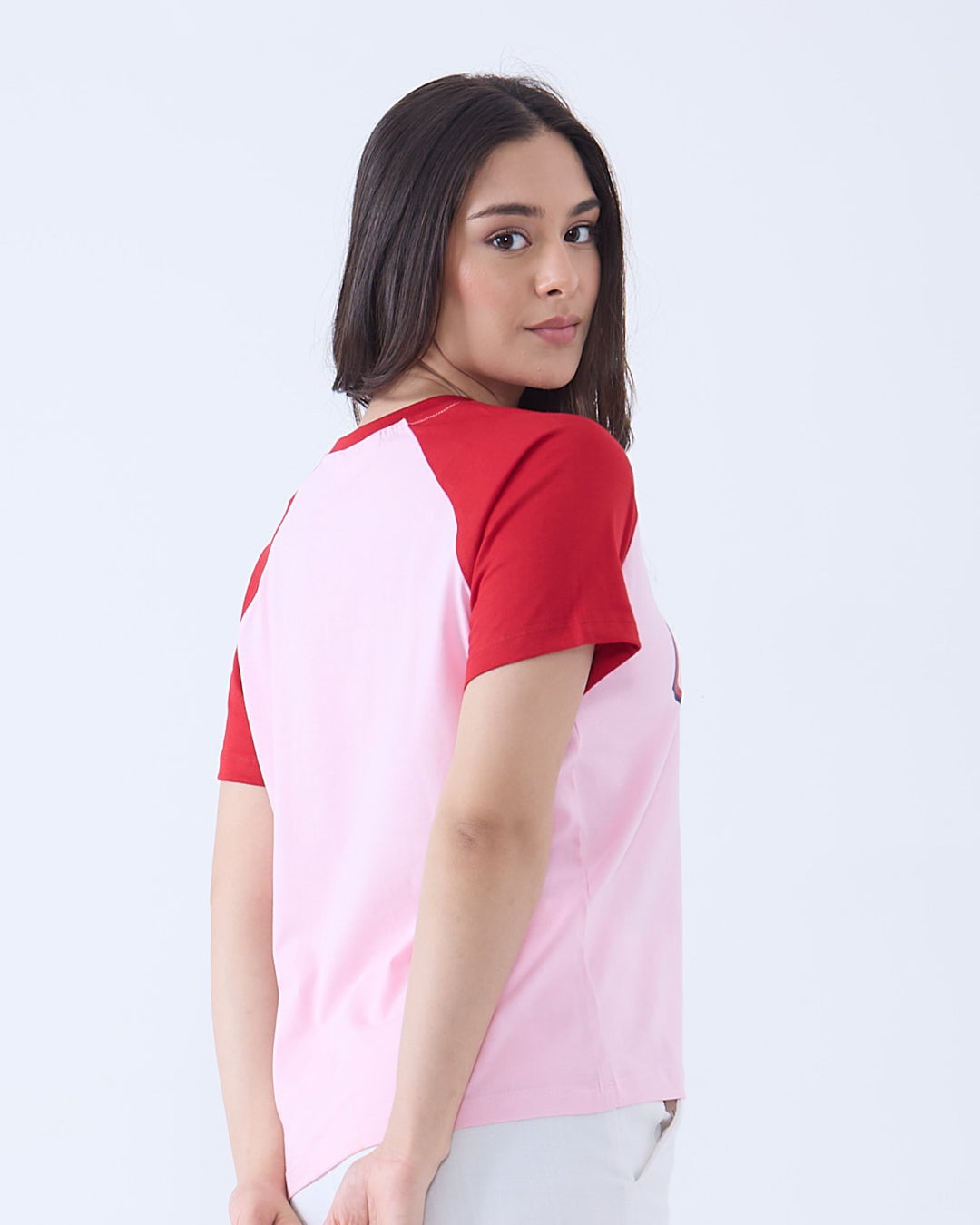 05 Sports Raglan T-Shirt – pink body with red sleeves, regular tee with plain design, worn by model