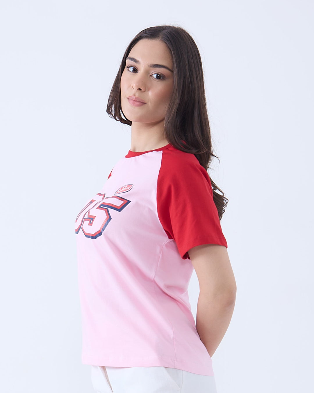 05 Sports Raglan T-Shirt – pink body with red sleeves, front 05 graphic, worn by model