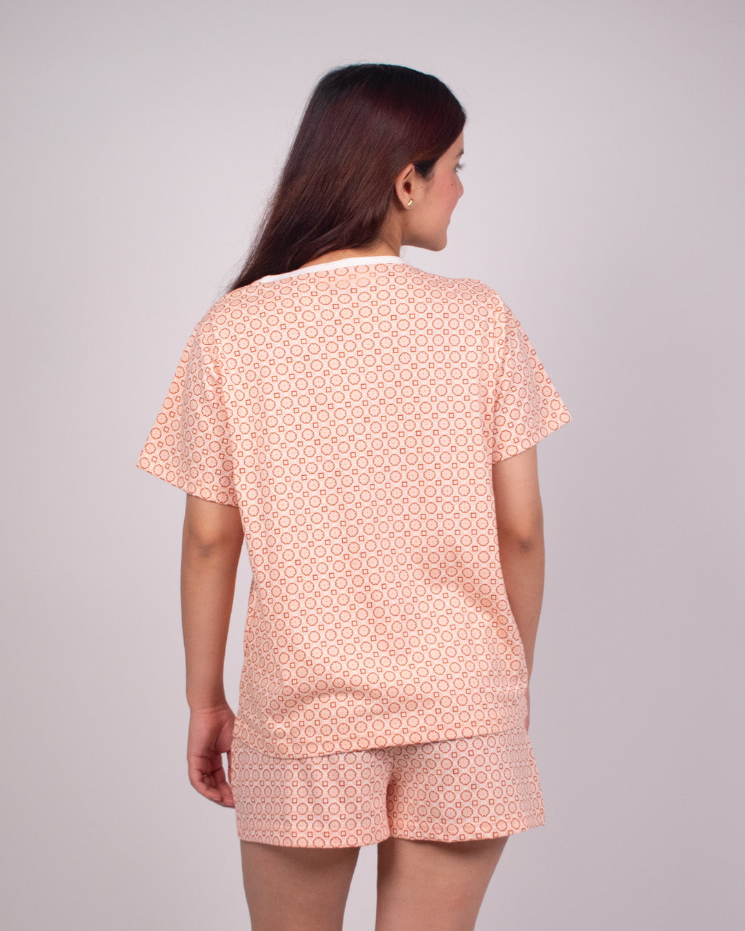 Abstract Cotton Shorts Set – peach geometric print, relaxed short-sleeve top with matching shorts, shown on model