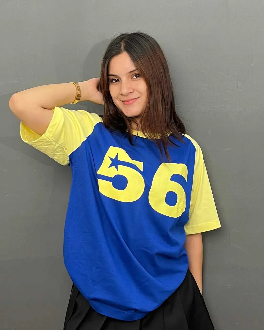 56 Raglan Oversized T-Shirt - blue body with yellow sleeves, oversized fit, DKY 56 graphic with star, worn by model