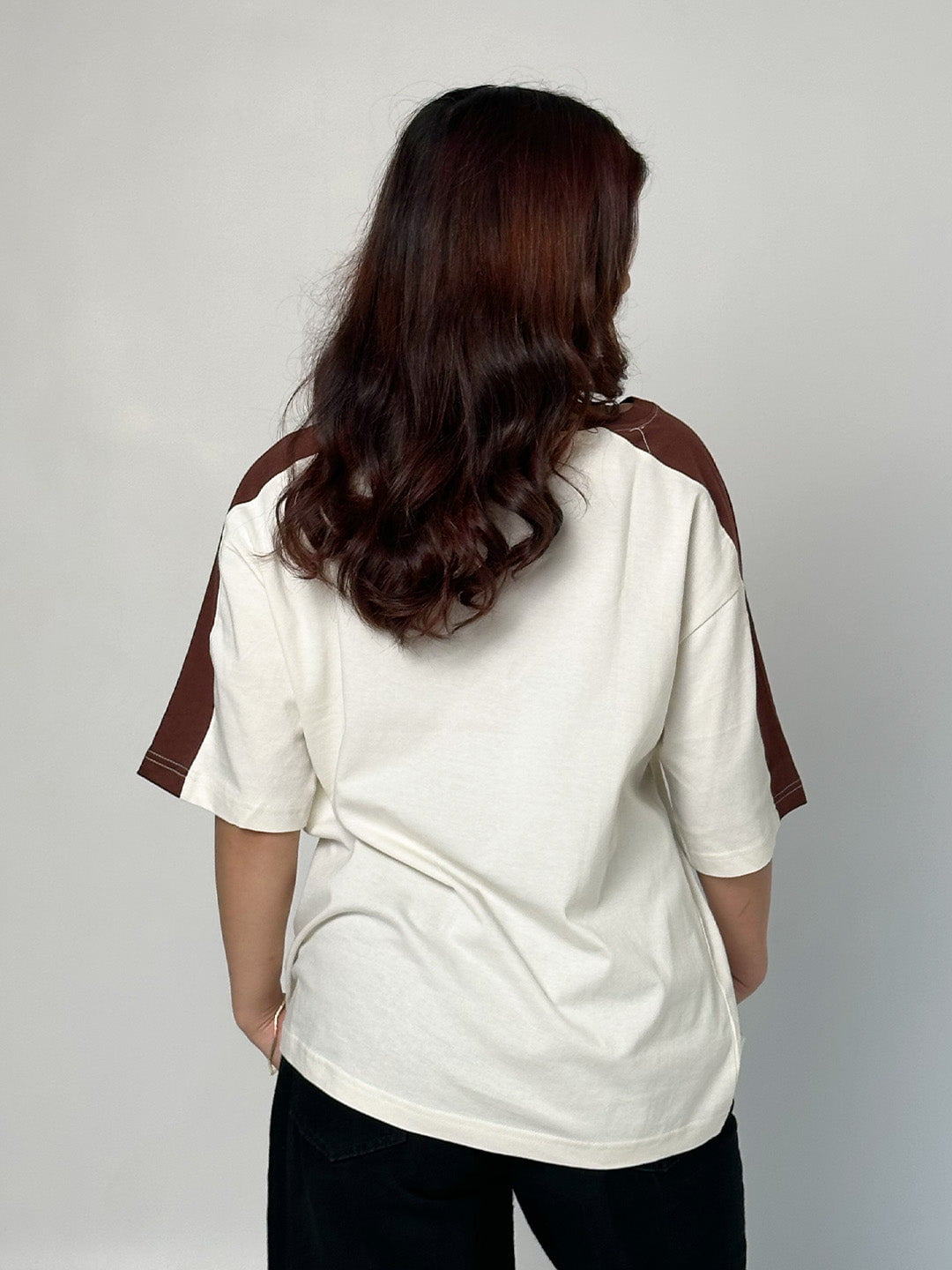 Off White Sage Oversized T-shirt - off-white body with brown raglan sleeves and oversized fit, worn by model
