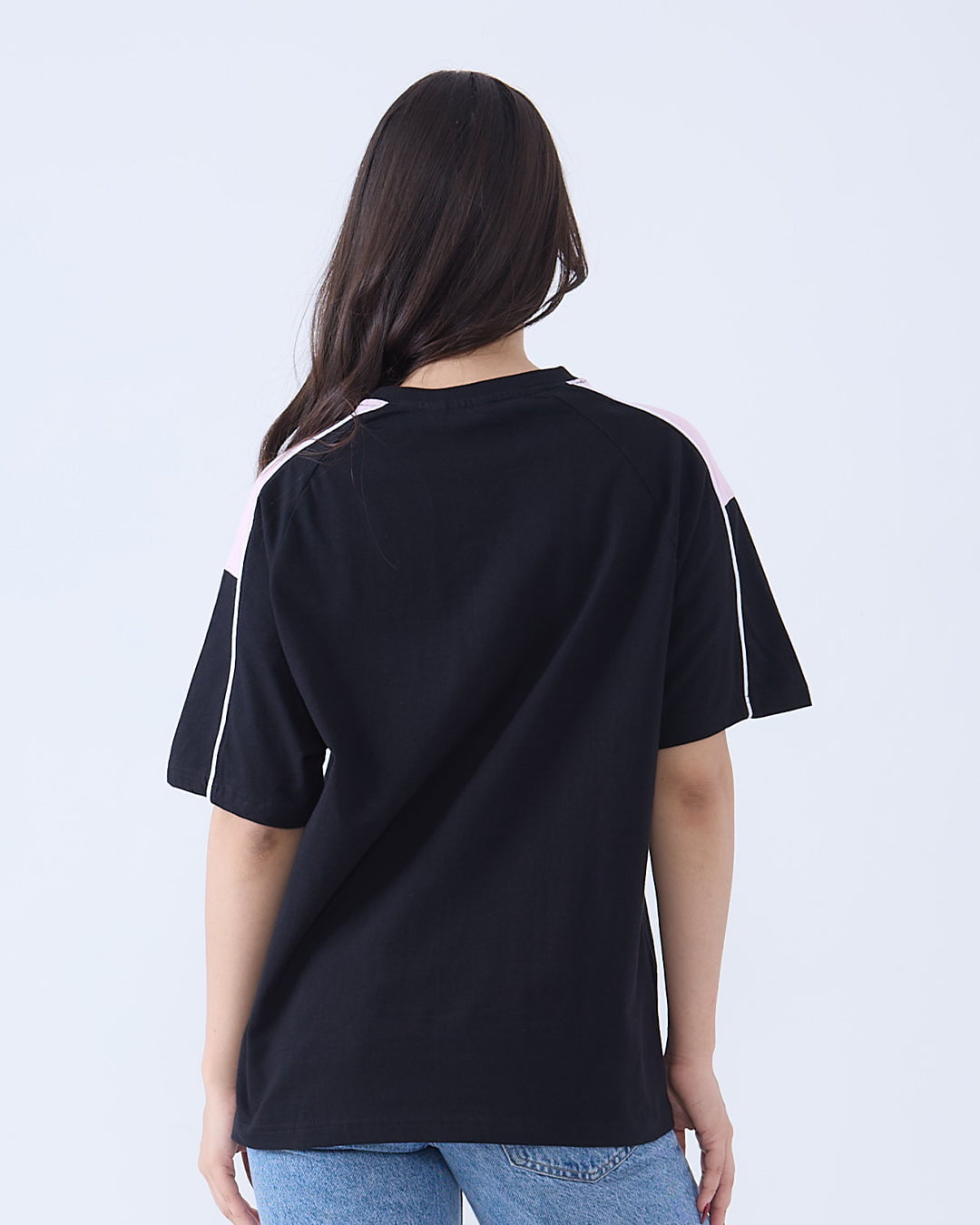 22 Downtown Oversized T-Shirt - black oversized tee with pink and white shoulder stripes, worn by model