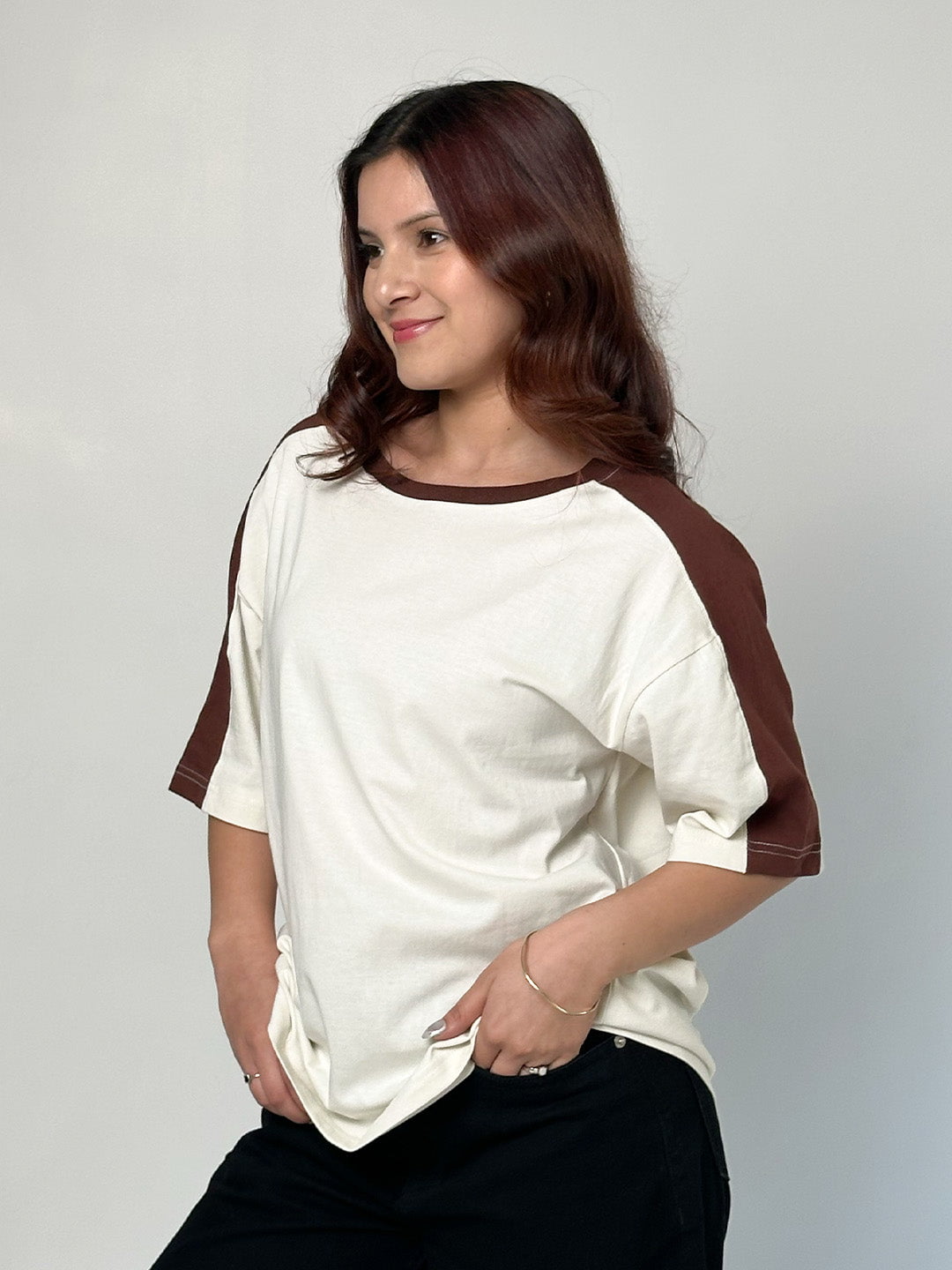 Off White Sage Oversized T-shirt – off-white body with brown raglan sleeves, two-tone color-block, worn by model