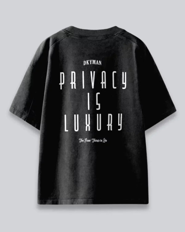 Arlo Privacy Is Luxury Oversized Tshirt – black 100% cotton oversized tee with PRIVACY IS LUXURY graphic shown in flat lay