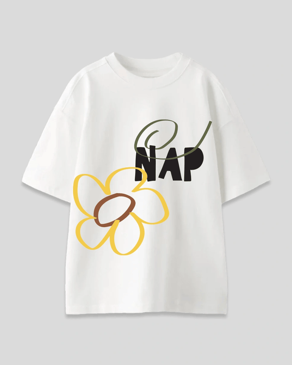 Nap Oversized T-Shirt – white graphic tee with a yellow flower and black NAP text, flat lay.