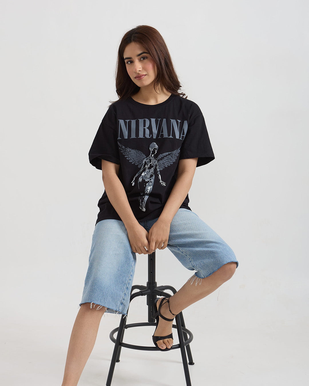 Angel Wings Oversized T-Shirt – black graphic tee with Nirvana wings print, worn by model.