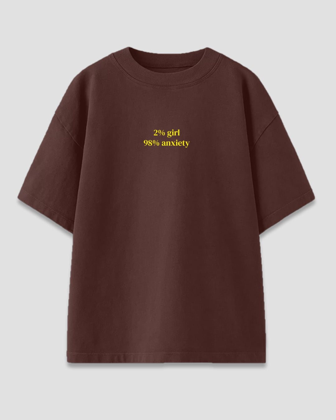 Anxious Core Oversized T-Shirt – brown tee with yellow 2% girl 98% anxiety slogan, flat lay