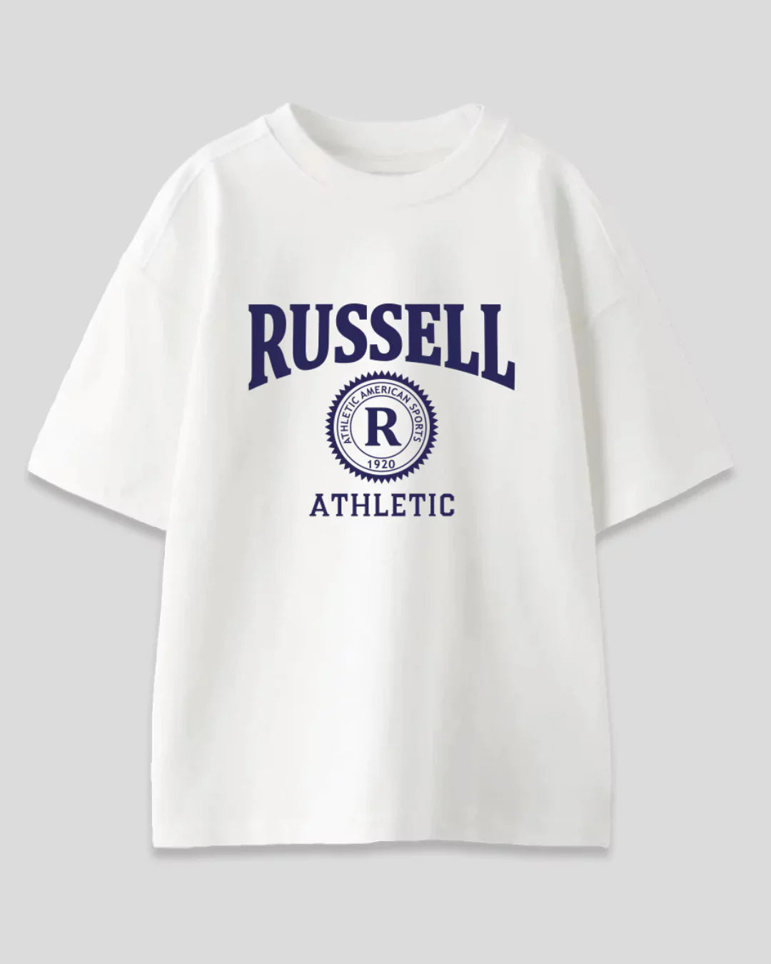 Arlo Russell Oversized T-Shirt – white graphic tee with circular Russell Athletic emblem, shown flat lay
