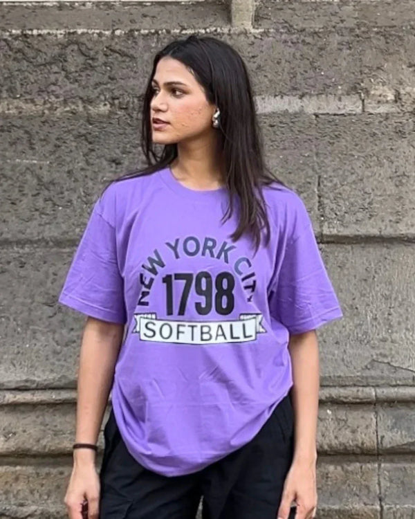 Arlo Softball Oversized T-Shirt – purple oversized tee with softball graphic, worn by model