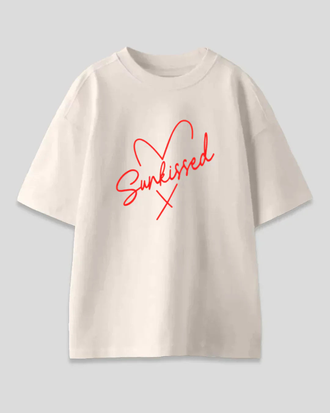 Arlo Sunkissed Oversized T-Shirt – cream cotton tee with bold red Sunkissed script graphic, shown in flat lay