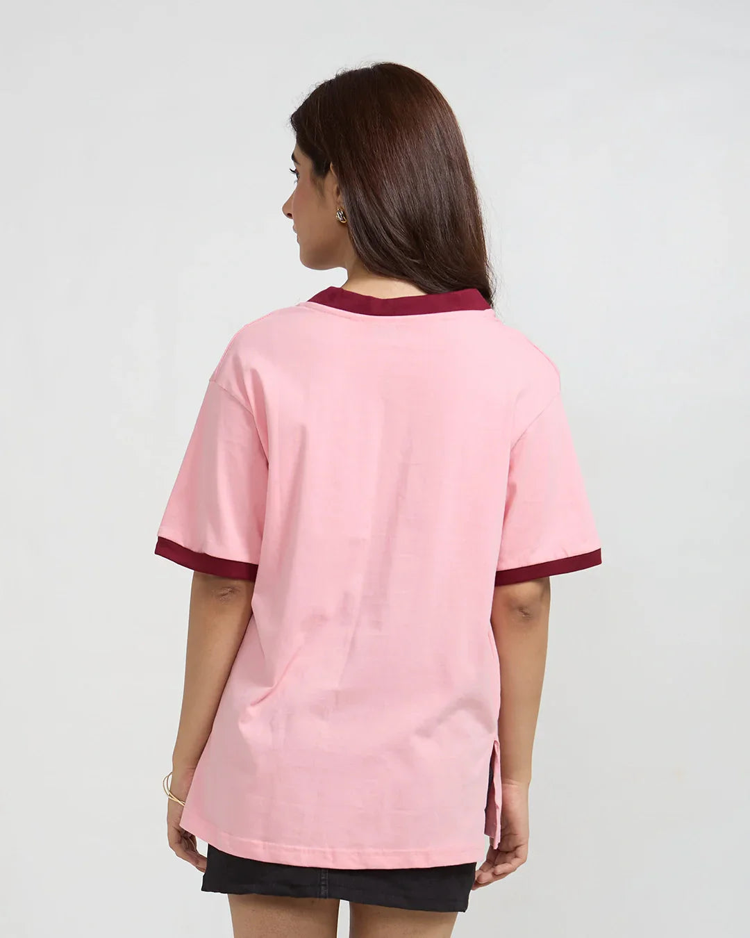 Atlanta Tap-Out V-Neck Oversize T-Shirt - soft pink oversized tee with burgundy neck and sleeve trim, worn by model