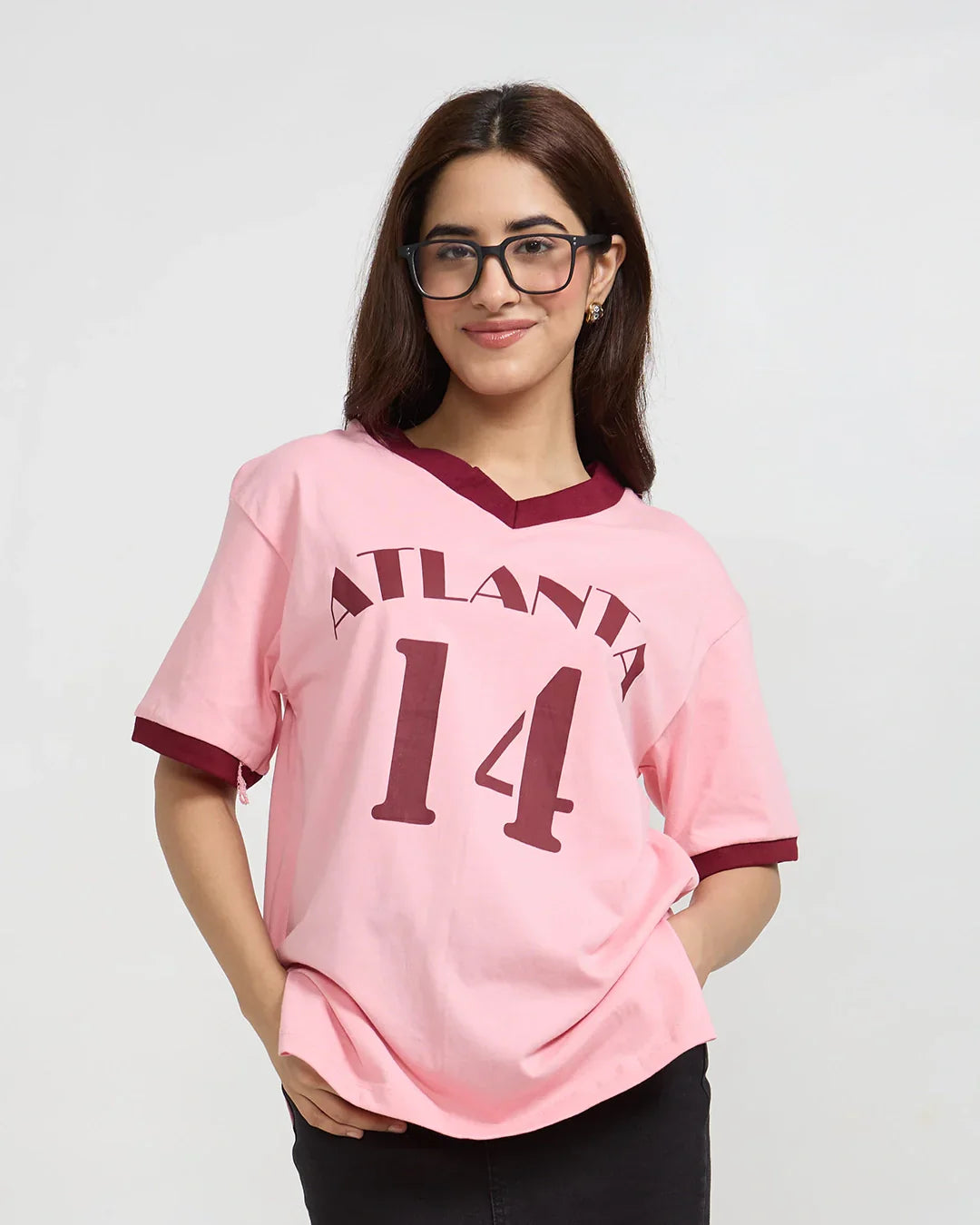 Atlanta Tap-Out V-Neck Oversize T-Shirt – pink with burgundy trim and ATLANTA 14 graphic, worn by model