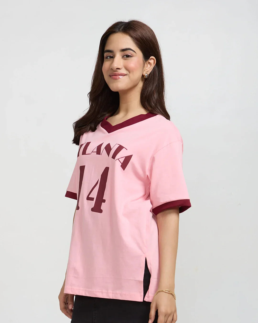 Atlanta Tap-Out V-Neck Oversize T-Shirt - pink tee with maroon V-neck trim and Atlanta 54 print worn by model