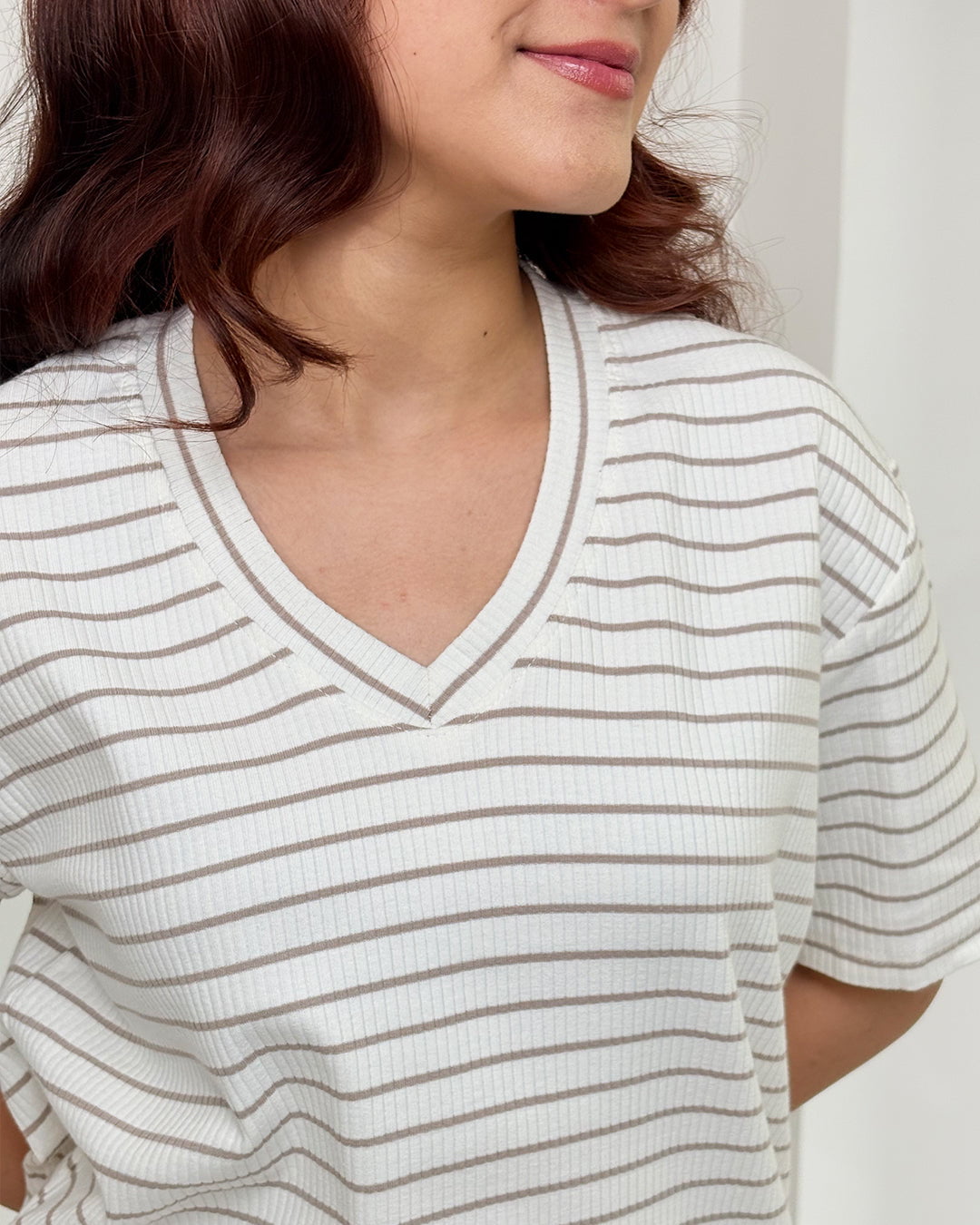 Beige Ribbed Co-Ord Set – white knit V-neck top with beige stripes, worn by model