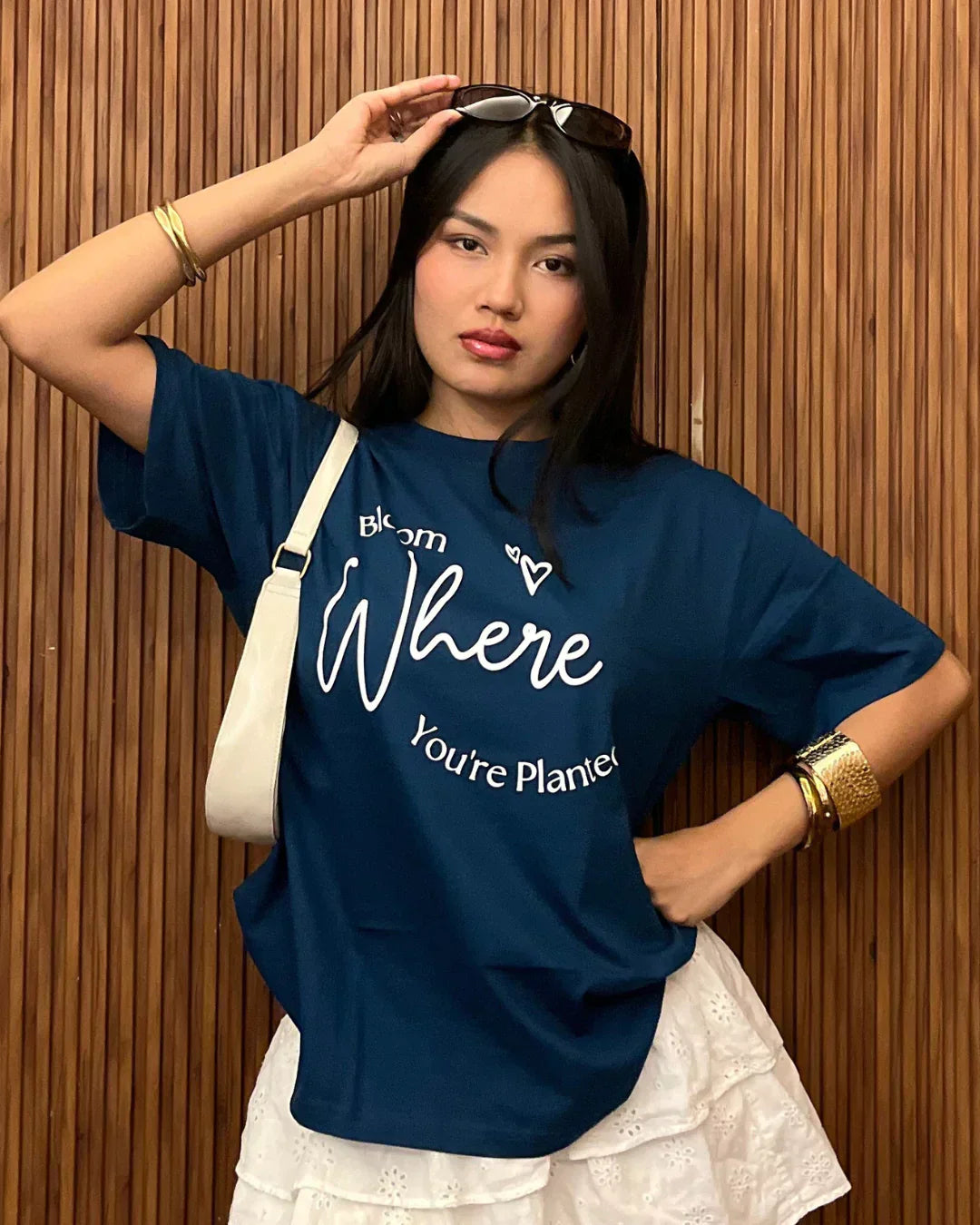 Bloom Where You Are Planted Oversized T-Shirt – navy blue graphic tee with white script print, worn by model