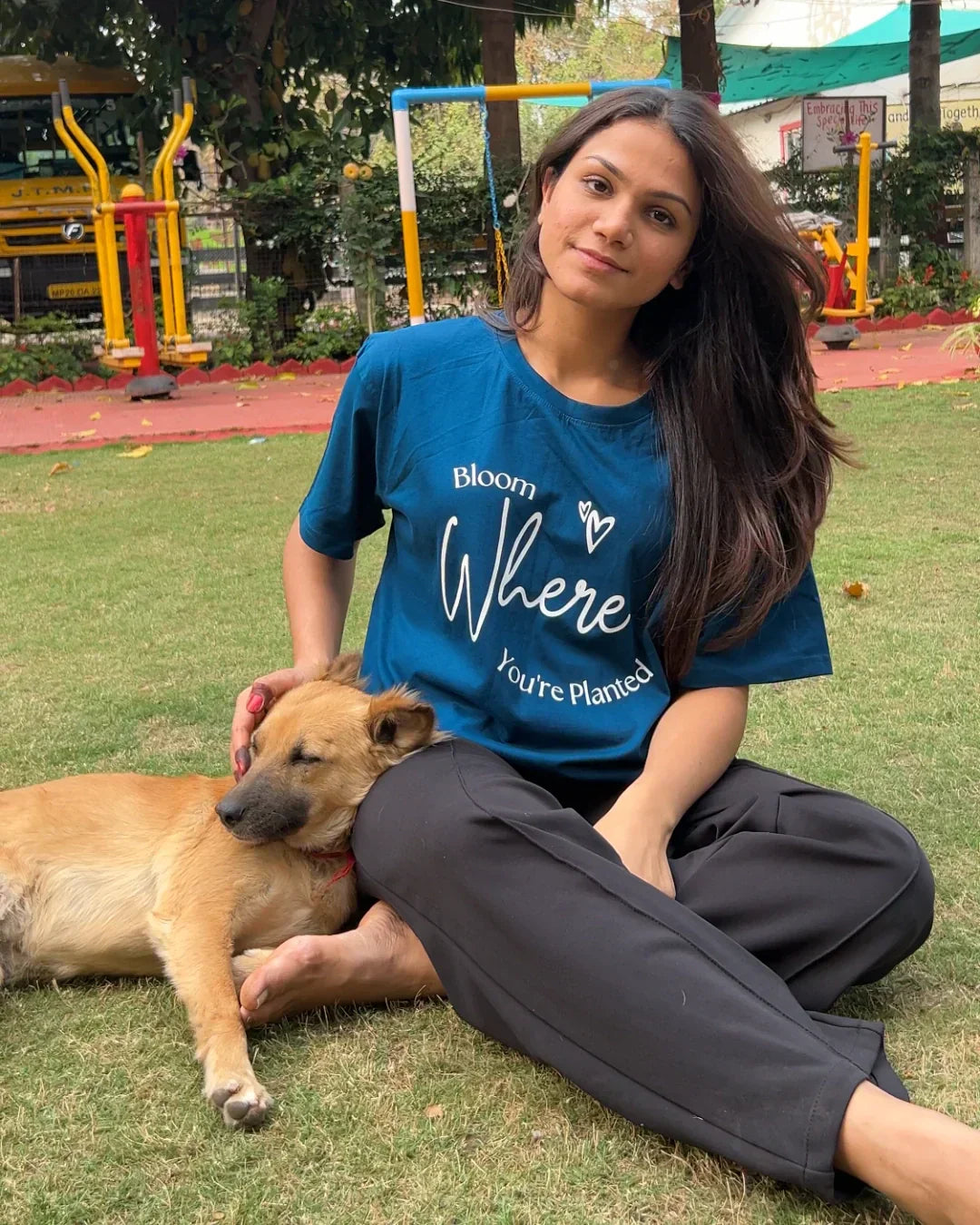 Bloom Where You Are Planted Oversized T-Shirt – teal oversized graphic tee with white script text, worn by model.