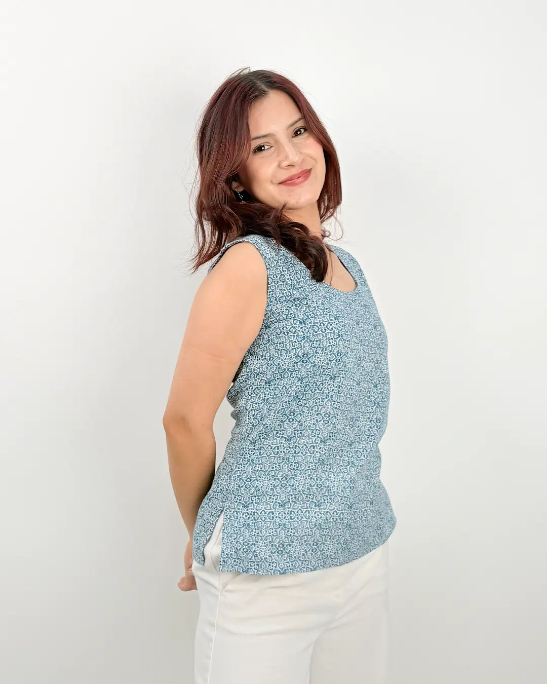 Blue Zoya Drop Short Kurti – blue printed sleeveless kurti top with side slits, worn by model