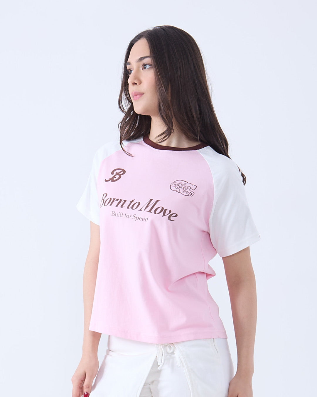 Born to Move Edgy T-Shirt – pink body with white sleeves, DKY logo and Born to Move text, worn by model.