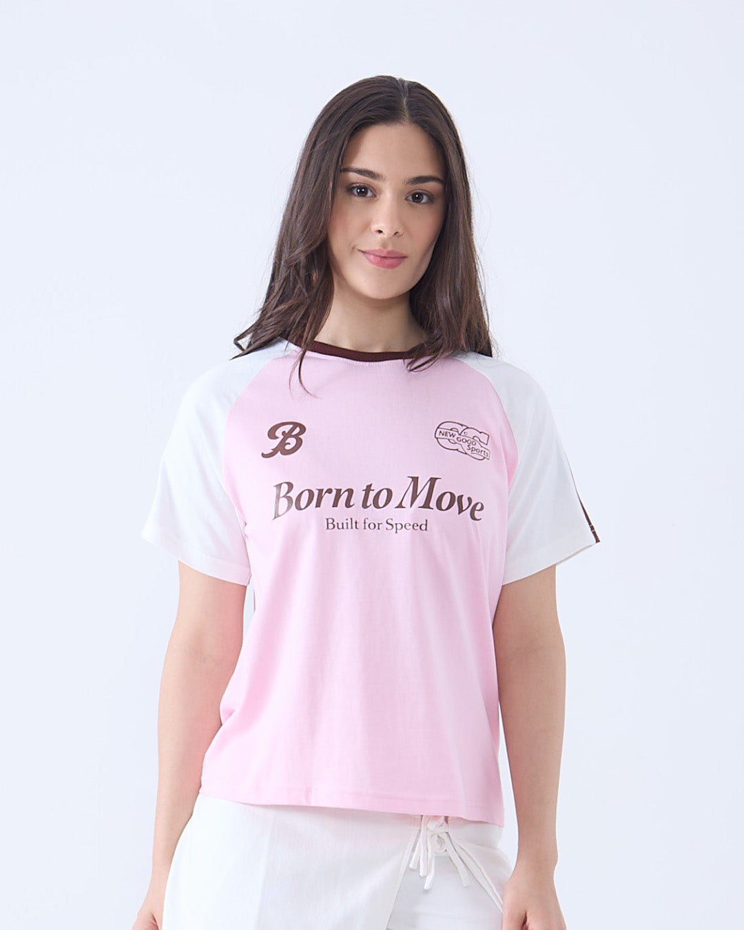 Born to Move Edgy T-Shirt – pink body with white raglan sleeves, regular tee with Born to Move print, worn by model