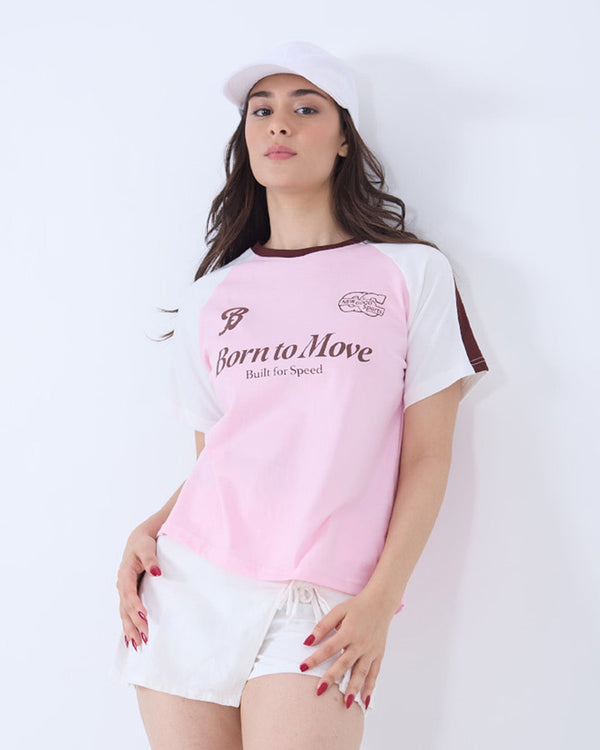 Born to Move Edgy T-Shirt – pink body with white sleeves, bold graphic text on chest, worn by model.