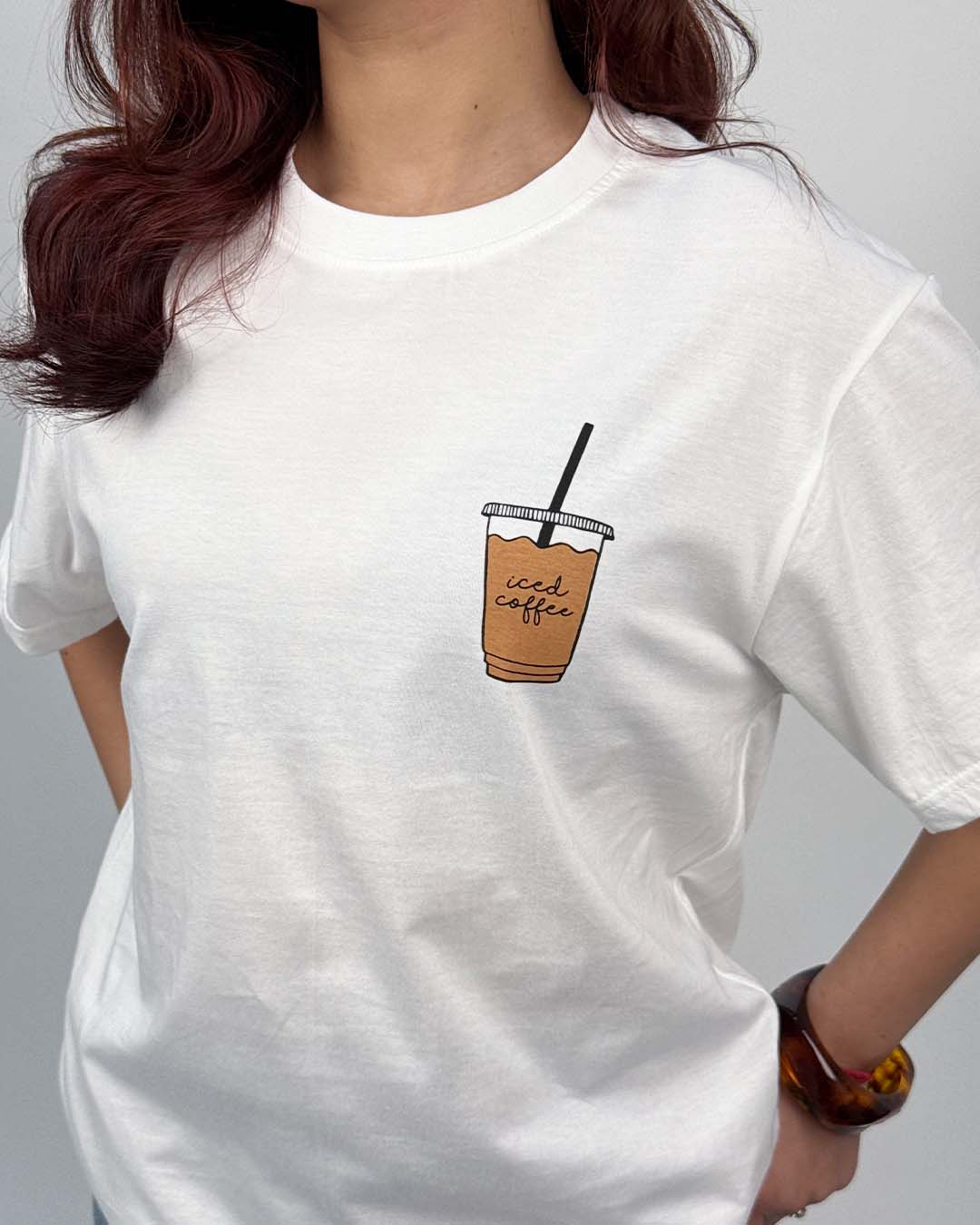 Break Glass Oversized T-Shirt – white oversized tee with iced coffee graphic on chest, worn by model