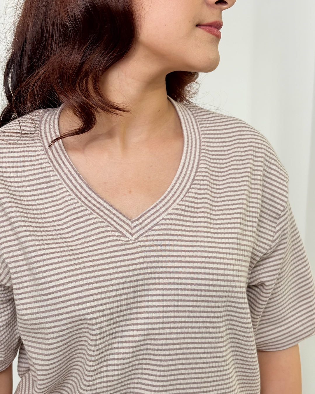 Brown Ribbed Co-Ord Set top by DKY in beige-brown stripes, ribbed knit with V-neck, worn by model