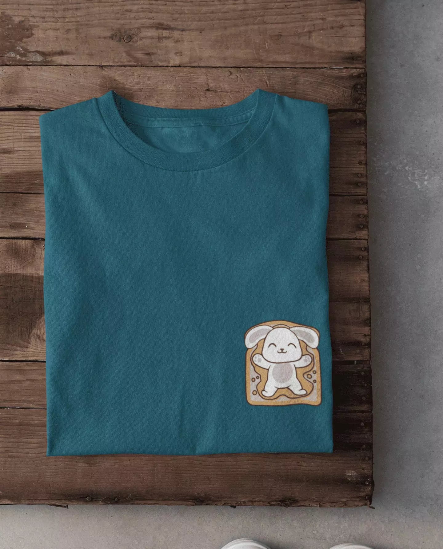 Bunny Toast T-Shirt – teal DKY regular tee with a bunny-on-toast patch on the lower right.