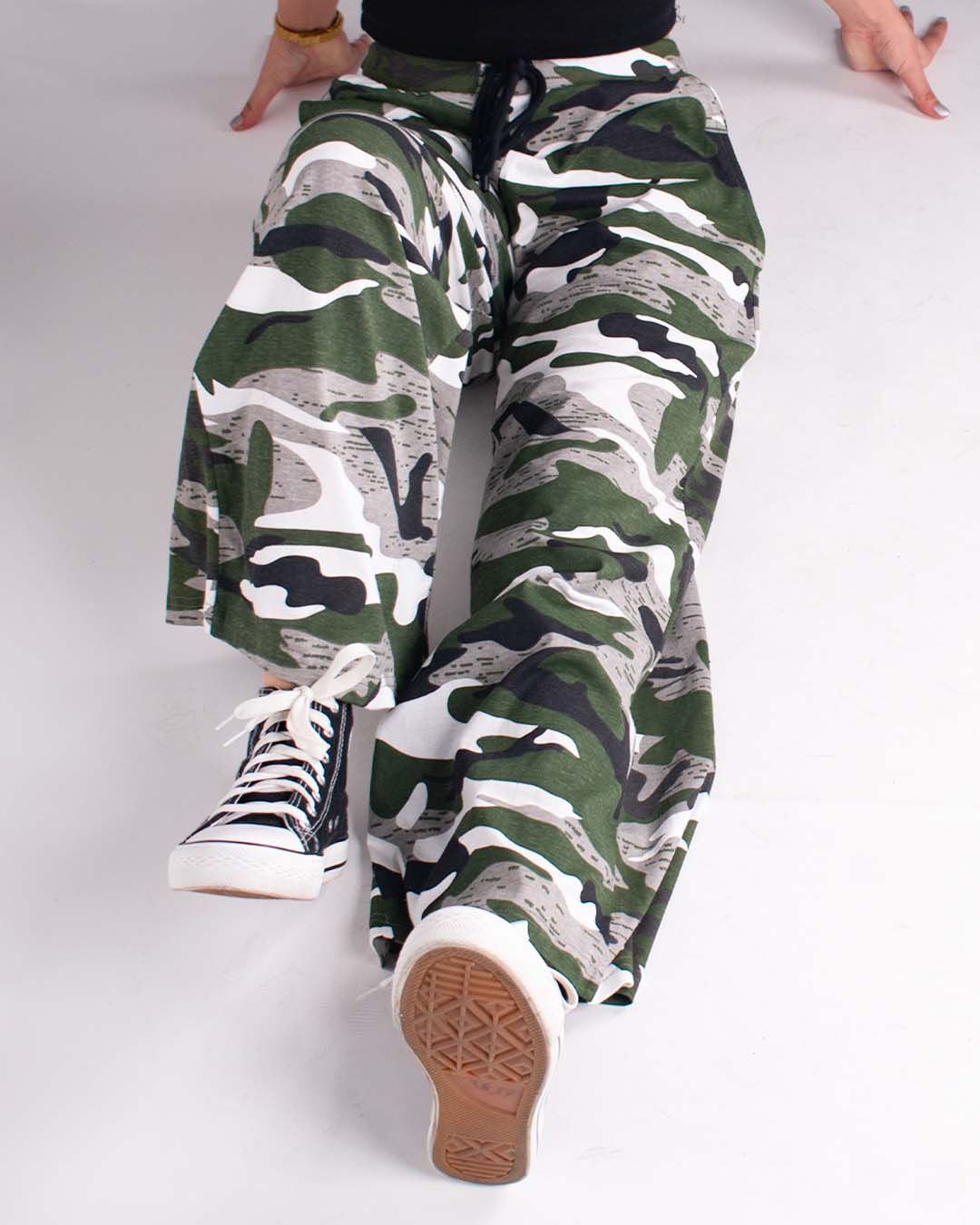 Camo Pajama – DKY green camouflage relaxed-fit pajama pants with drawstring, worn by model