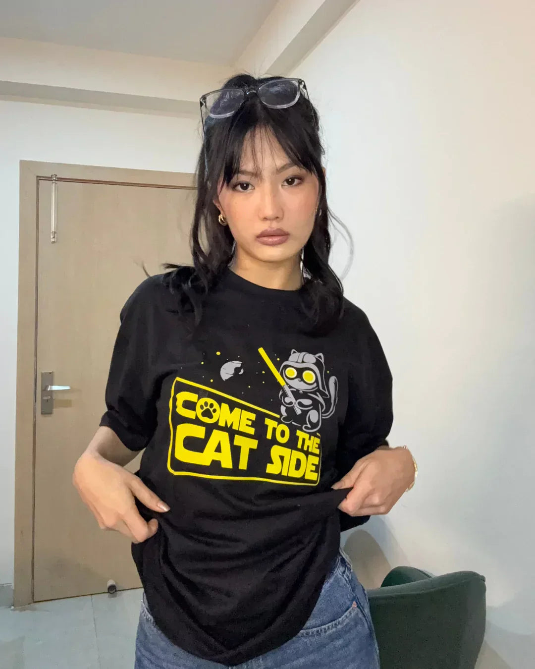 Cat Side Oversized T-shirt – black DKY OS Graphic with yellow cat print, worn by model
