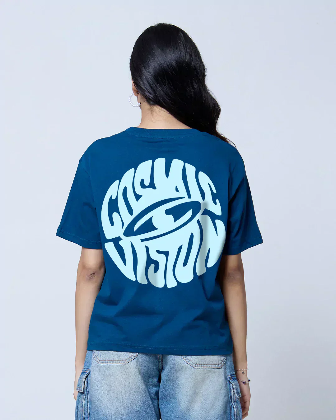Cosmic Vision Boxy Oversize T-Shirt – teal blue boxy tee with a large white circular graphic on the back, worn by model