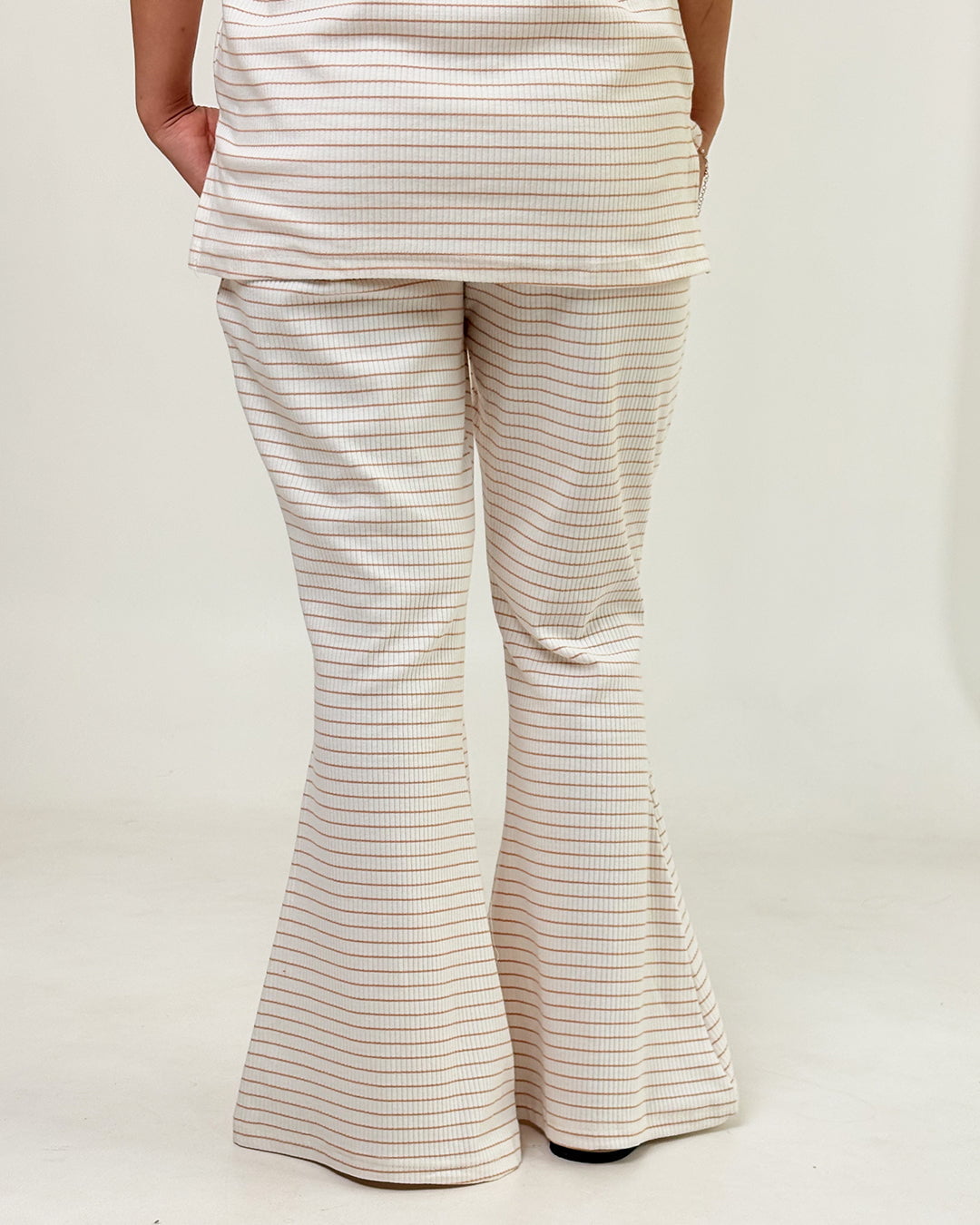 Cream Ribbed Co-Ord Set - cream ribbed knit with brown stripes, relaxed top and flared pants, worn by model