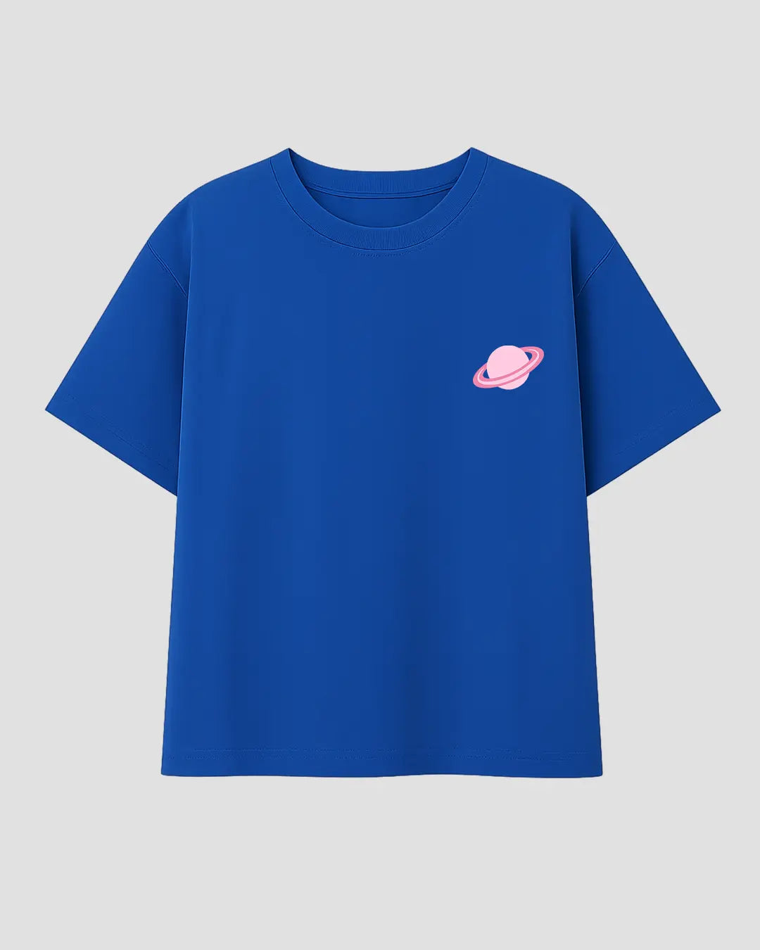 Create Your Own World RB Boxy T-Shirt – royal blue boxy tee with pink planet graphic, shown in flat lay