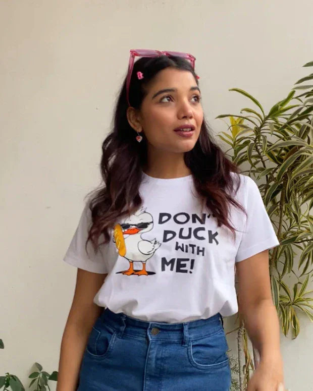 Don't Duck With Me T-Shirt by DKY, white regular graphic tee with a cartoon duck and bold text, worn by a model.