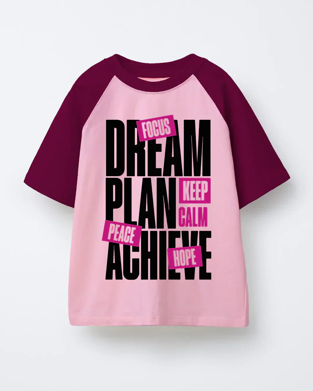 Dream Raglan Oversized T-Shirt - pink body with burgundy sleeves, bold black DREAM PLAN ACHIEVE graphic with pink labels