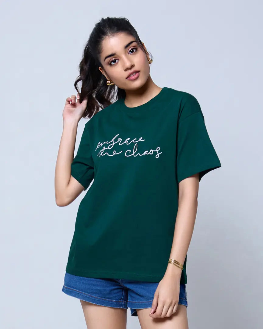 Embrace The Chaos Oversized T-Shirt – green oversized tee with white script text, worn by model