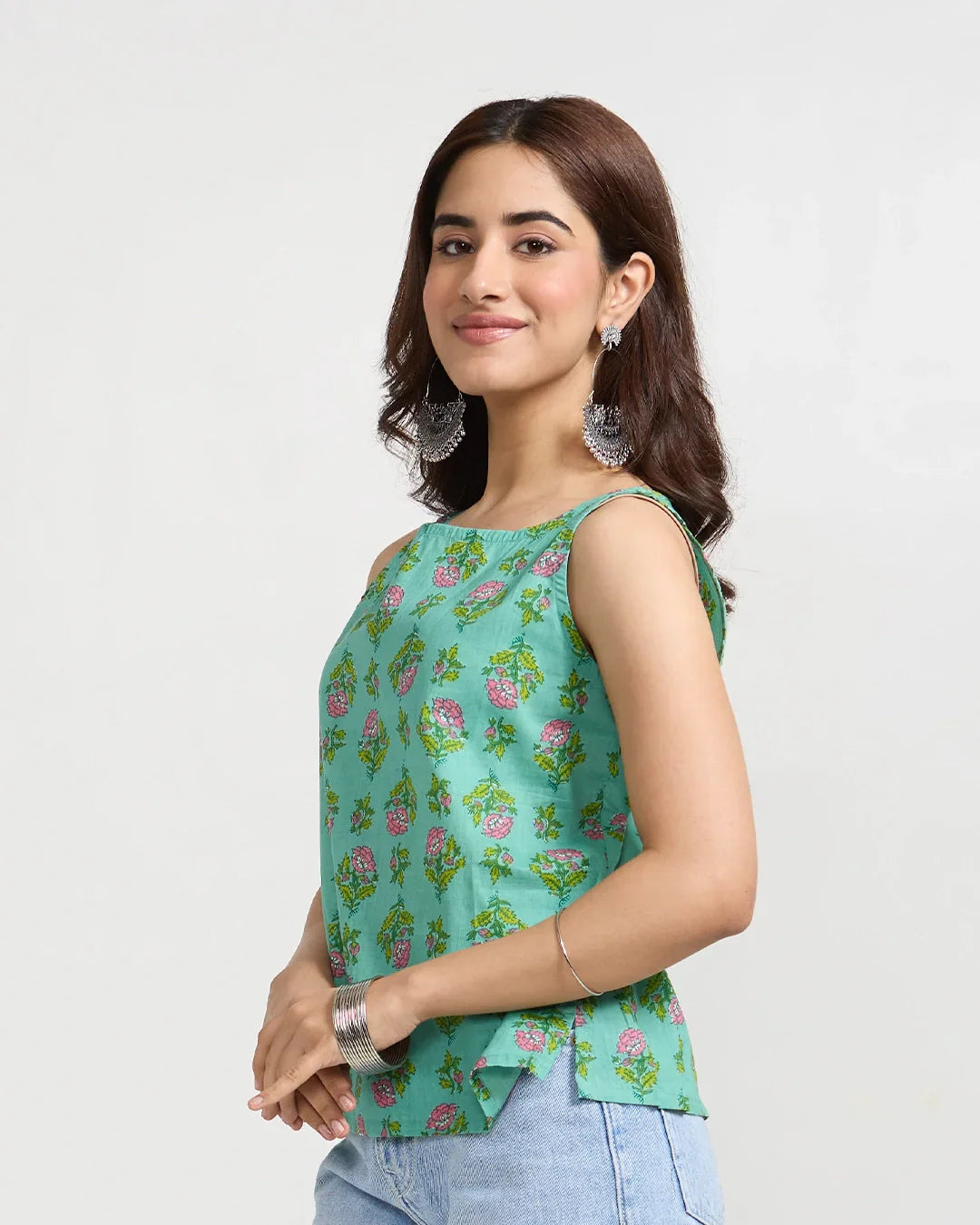 Floral Fix Short Cotton Top – teal green sleeveless printed top with pink floral pattern, worn by model