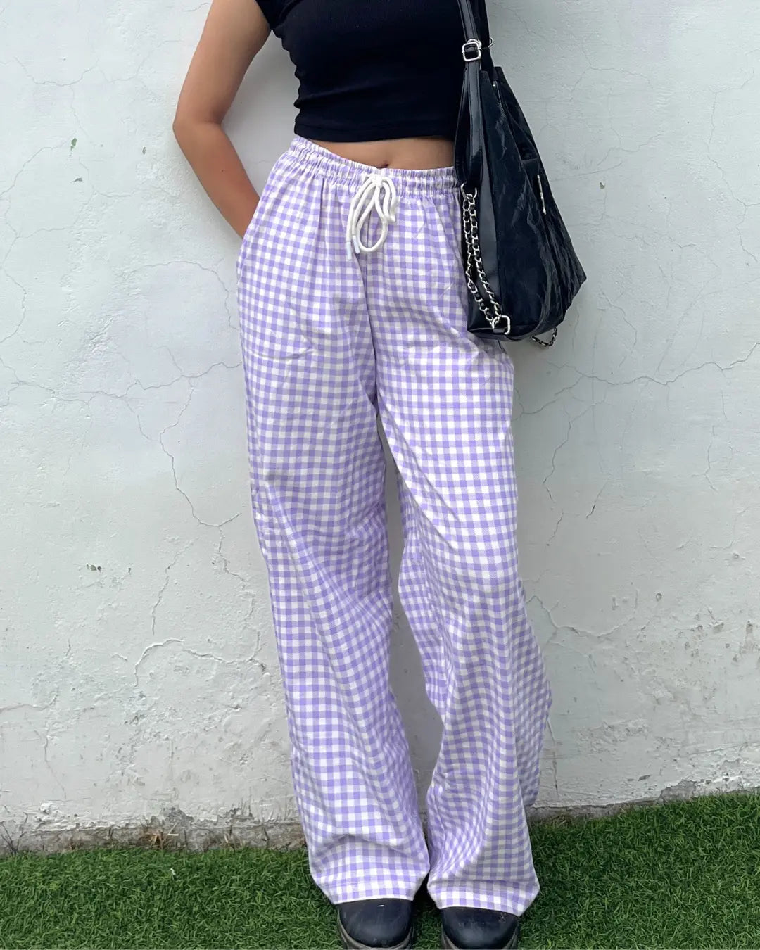 Haze Pajama – lavender gingham pajama pants with white drawstring, worn by model