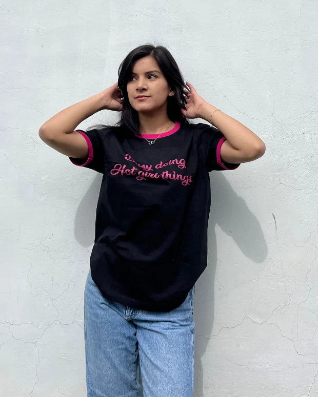 Hot Girl Things Tap Out T‑Shirt – black regular tee with pink trim and pink script design, worn by model
