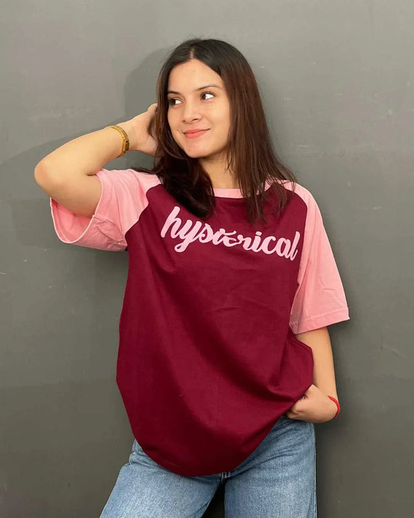 Hysterical Raglan Oversized T-Shirt - burgundy body with pink sleeves, white hysterical script across chest, worn by model