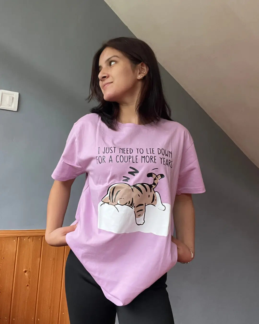 I Just Need To Lie Down T-Shirt – lavender relaxed-fit regular tee with a sleeping tiger graphic, worn by model