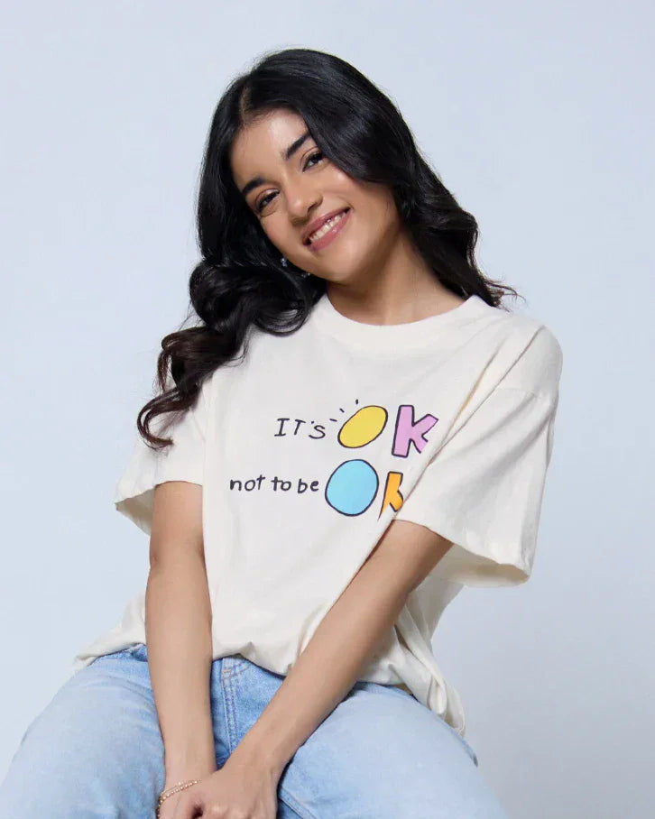 It's Ok Not To Be Ok Oversized T-Shirt - cream off-white with DKY graphic print, worn by model