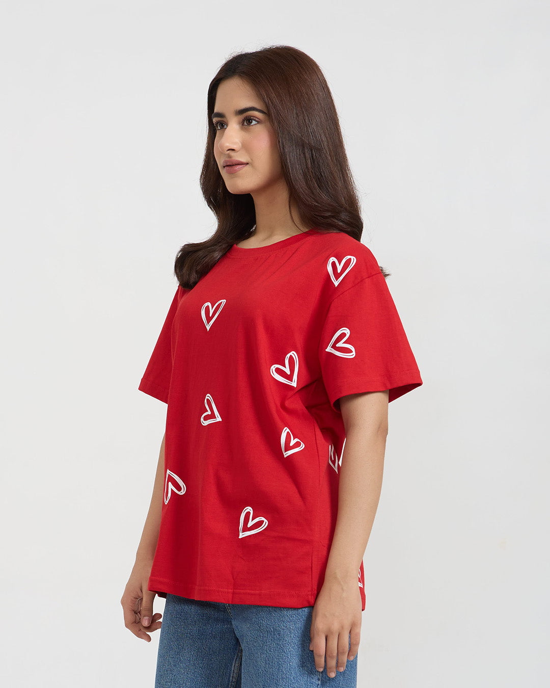 Juliet Oversized T-Shirt - red oversized t-shirt with white heart outlines, worn by model