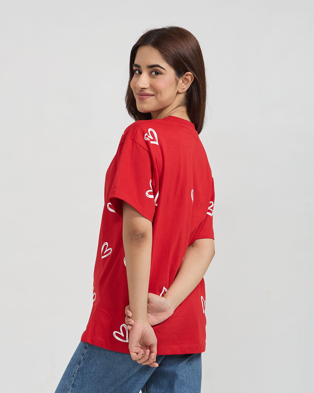 Juliet Oversized T-Shirt – red DKY shirt with white heart prints, worn by model