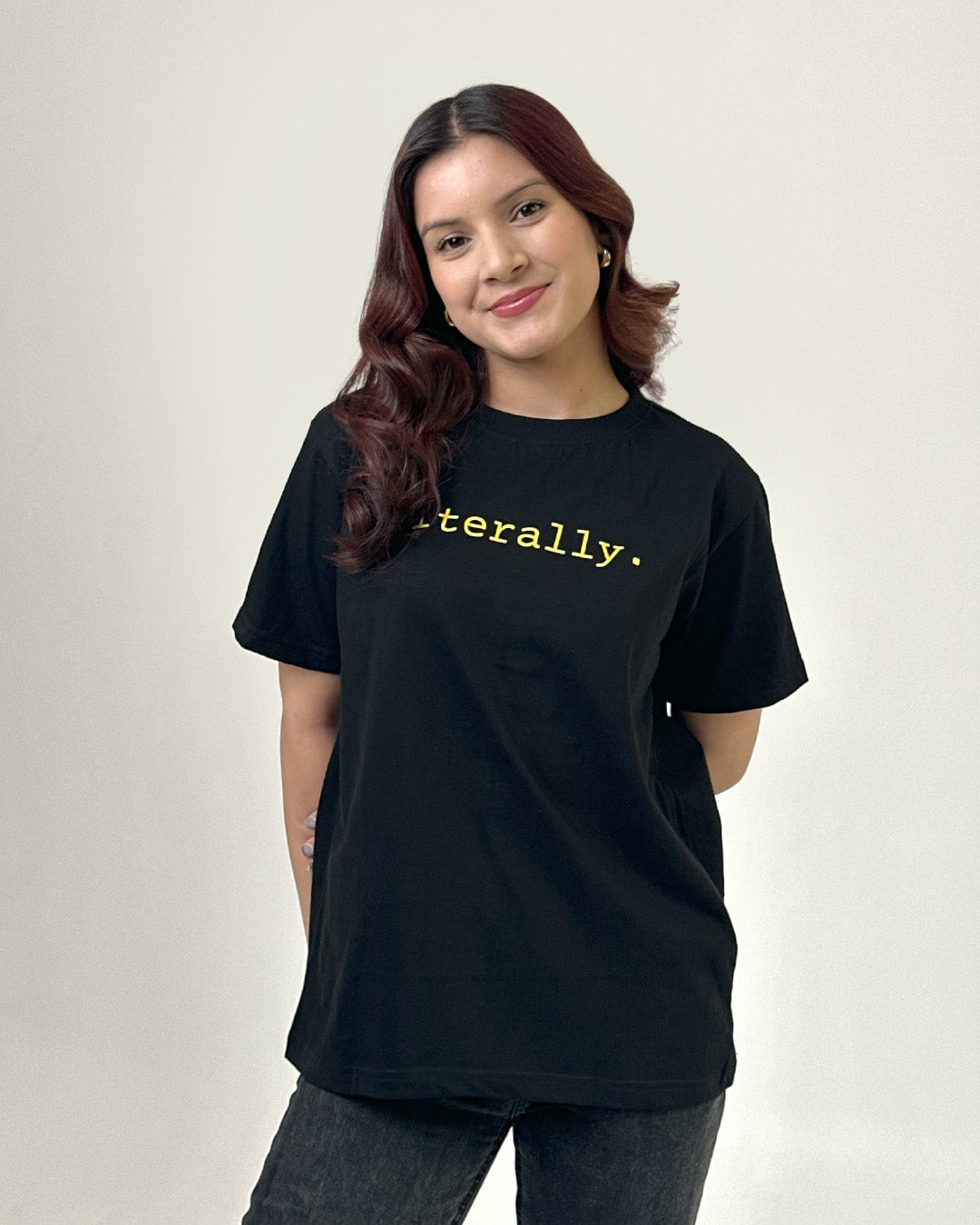 Literally T-Shirt – black regular tee with yellow literally graphic, worn by model.