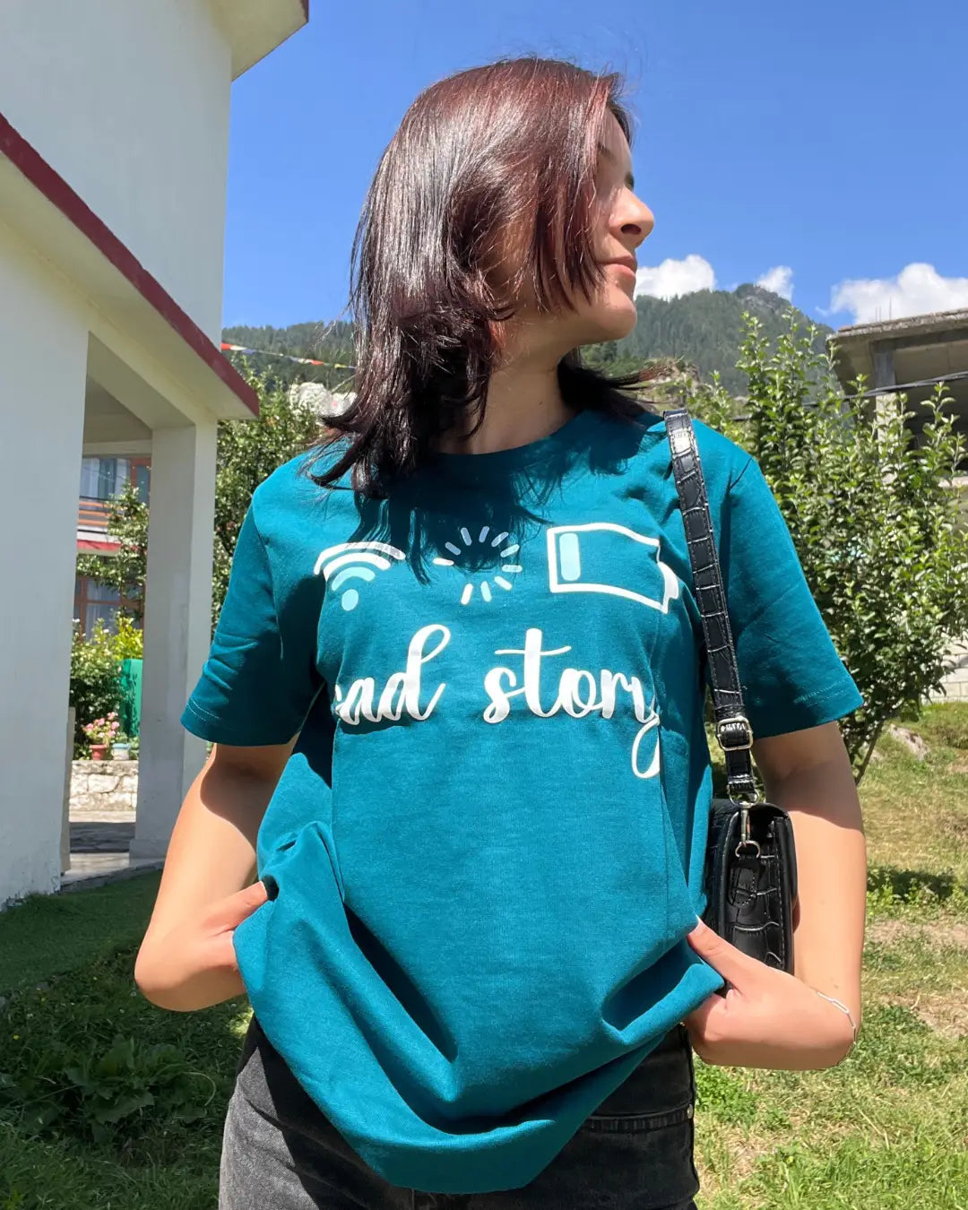 Loading T-Shirt - teal DKY regular tee with a white loading graphic (wifi and battery icons), worn by model