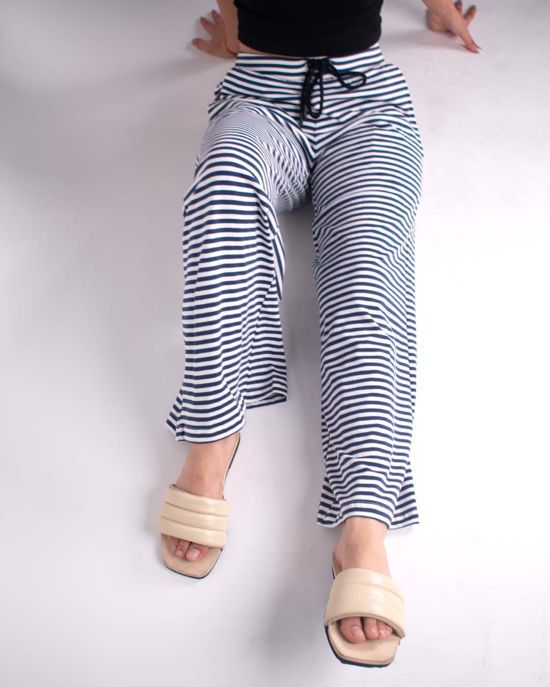 Midnight Pajama - navy and white striped wide-leg pajama pants with drawstring, worn by model