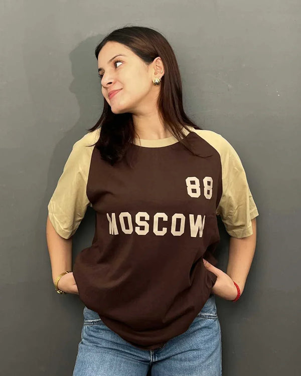 Moscow Raglan Oversized T-Shirt – brown body with beige raglan sleeves, bold MOSCOW and 88 print, worn by model