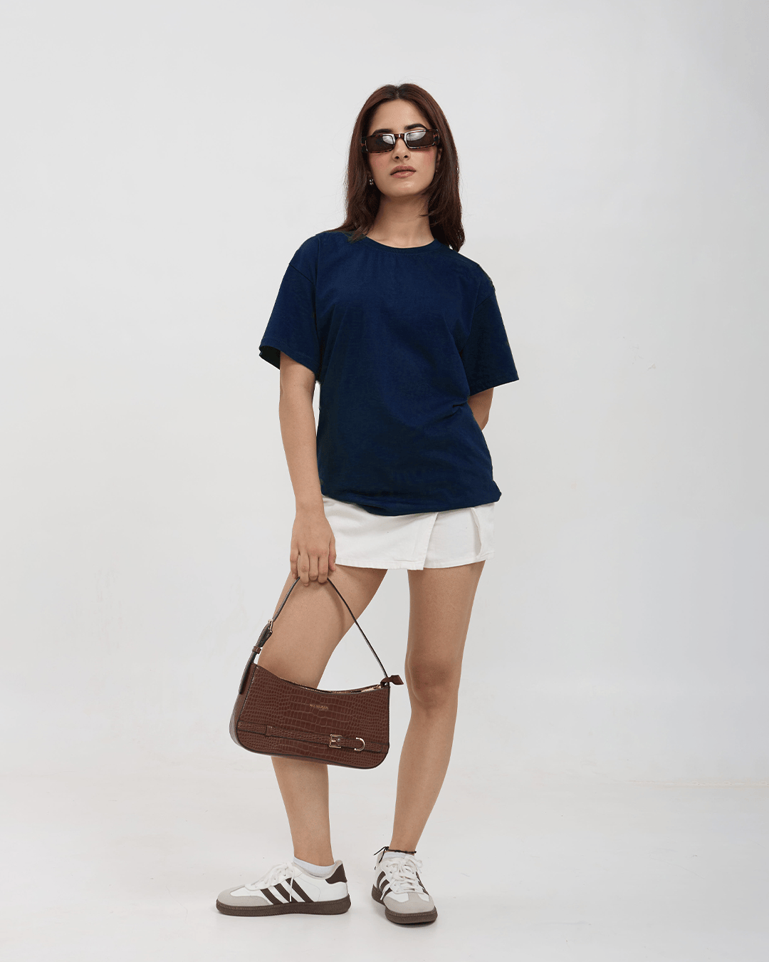 Navy Blue Plain Oversized T-Shirt by DKY – relaxed fit, worn by model with white shorts and brown handbag