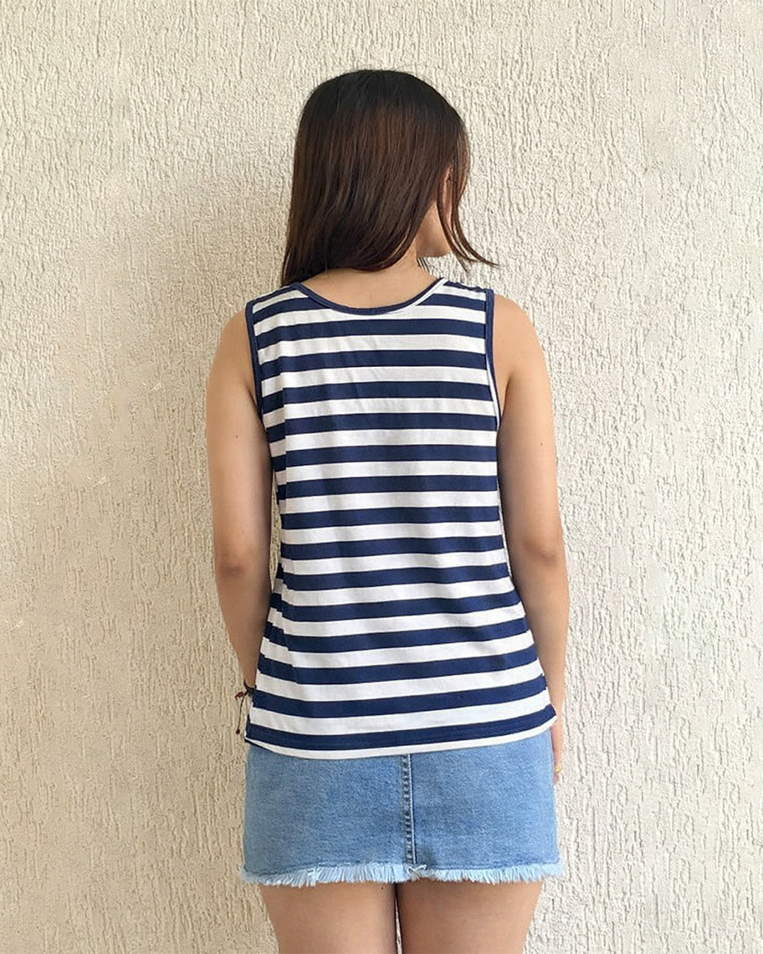 NB Sleeveless Scoop Neck T-Shirt – navy and white striped top with a relaxed fit, worn by model.